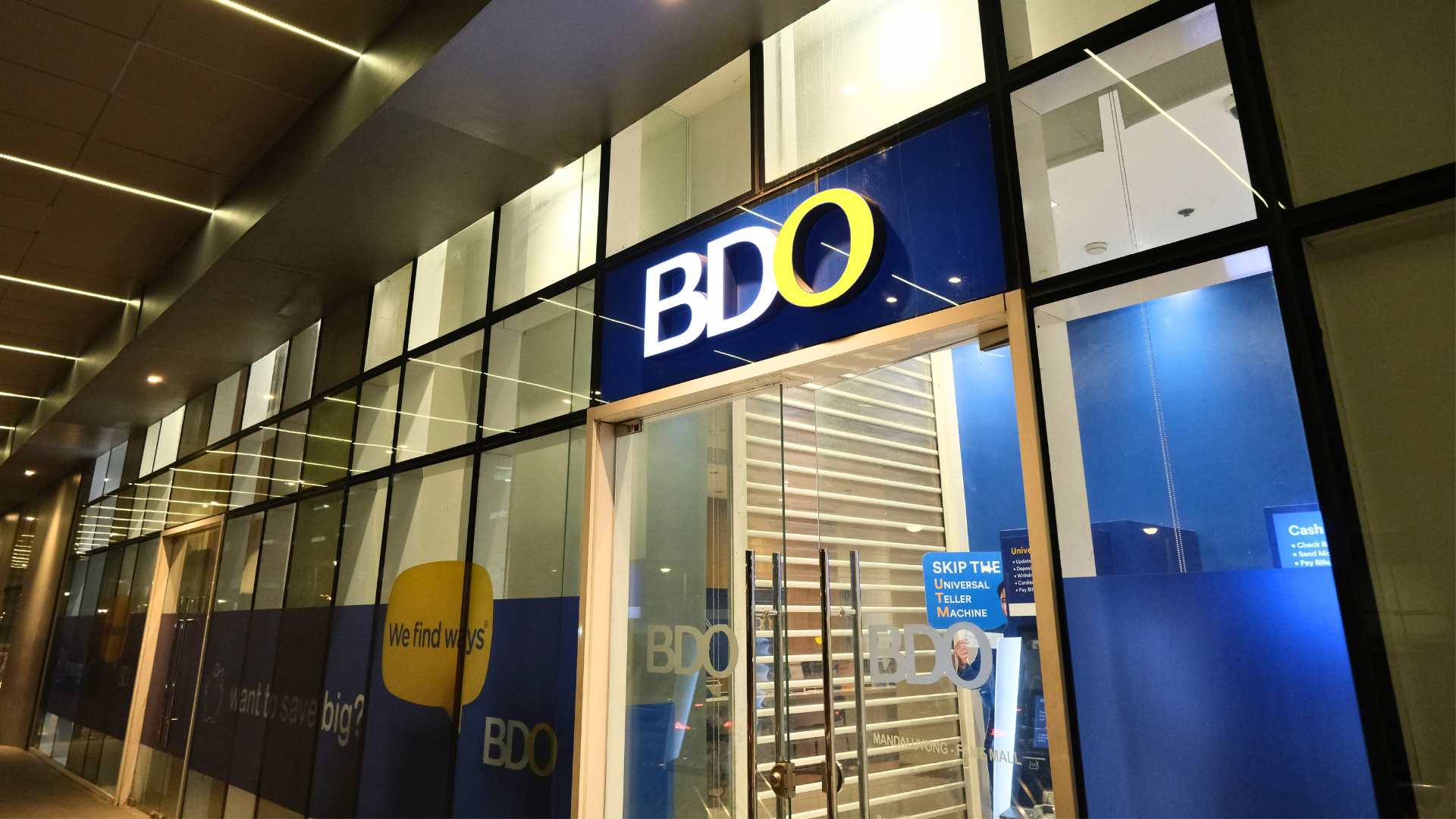 BDO bank branch storefront at night